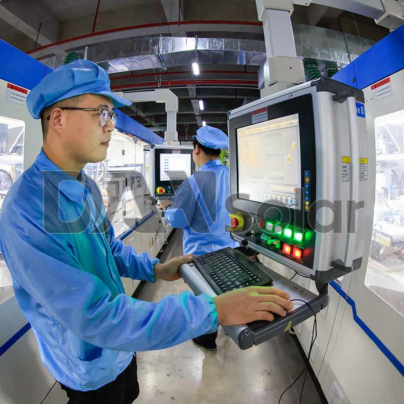 Workers in DAH Solar's smart photovoltaic production workshop are operating the automatic stringer